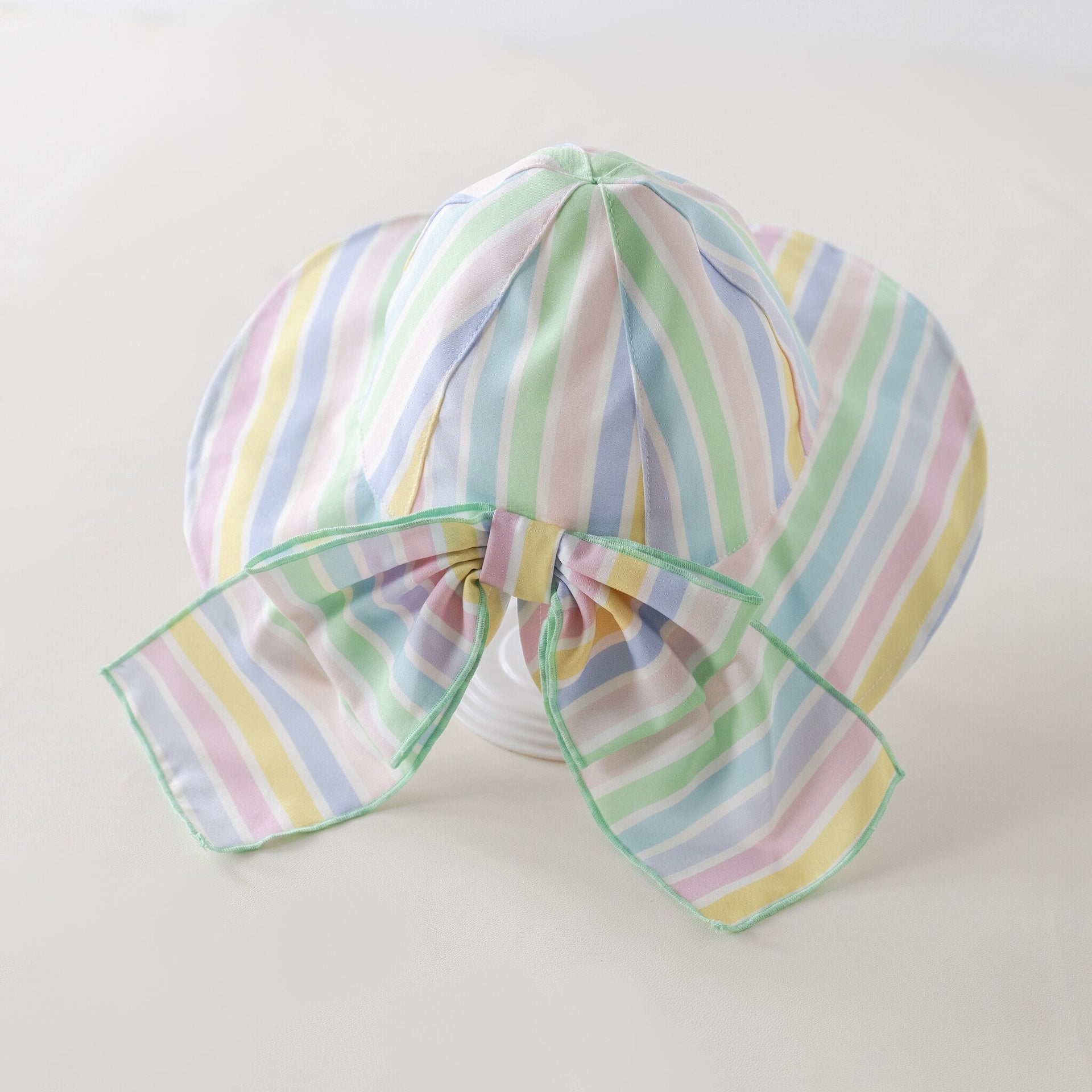 Pastel striped sun hat girl